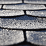 A close up of asphalt shingles on a San Antonio roofing system