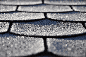 A close up of asphalt shingles on a San Antonio roofing system
