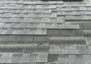 Wind damage on a San Antonio roofing system