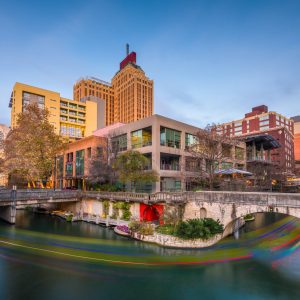 A vibrant photograph of San Antonio, Texas skyline, reflecting the city's architecture and roofing styles.